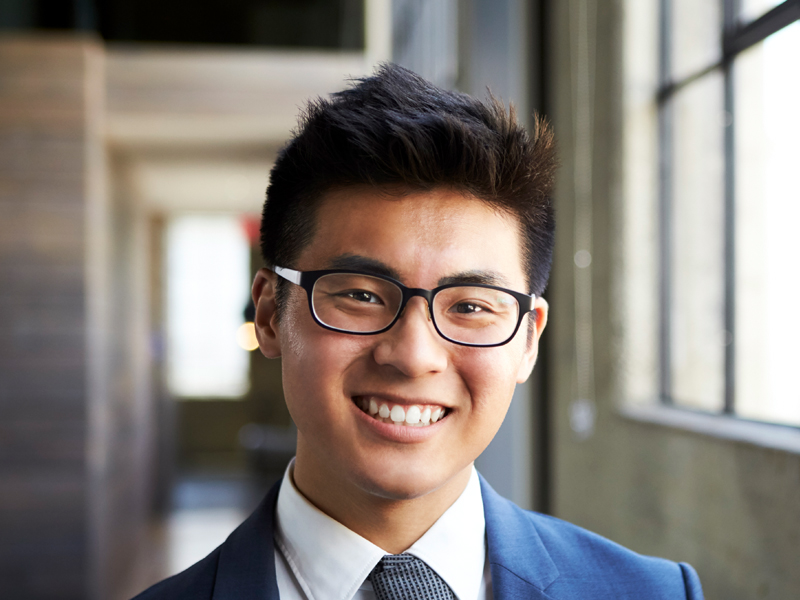 young-asian-businessman-smiling-to-camera-U7VL3Z8.jpg